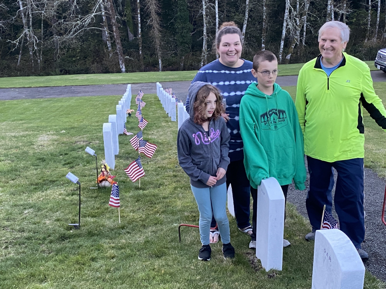Placing flags at Fort Stevens National Cemetery